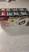 Front of boxed McCulloch MH1300 pressure washer showing model and PSI