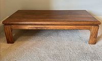 Full view of wooden coffee table front profile