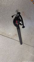 Full view of Toro corded electric leaf blower with tube attached