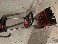 Full view of Toro Power Curve 1200 dethatcher with handle and cord