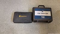 Soft zippered Triton Protect case beside hard Hendrick plastic case