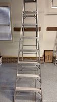 Full front view of Werner 8 ft aluminum step ladder
