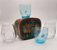 Group shot of box with two blue millefiori tumblers and two clear bee tumblers