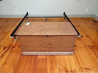 overall view of wood blanket chest closed on floor