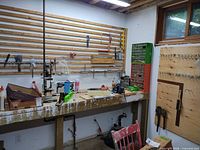 Workbench with drill press, hand plane, hardware organizer and assorted tools