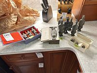 Group shot of all figurines with boxes on countertop