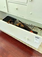 Drawer containing three saws and loose blades
