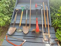 Group shot of all visible tools laid on steps