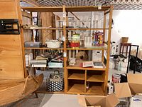Front view of bookcase showing shelves, cubbies, veneer finish, and overall structure