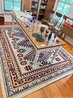 Full view of rug under table showing overall pattern and size