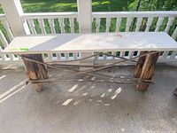 Full view of bench from front angle showing top and base