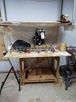 Wide view of radial arm saw mounted on wooden stand