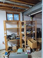 Both wooden shelving units assembled and standing side by side