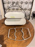 front view of assembled two-tier stand with platters and separate trivet