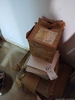 Stacked cardboard boxes of white ceramic tiles