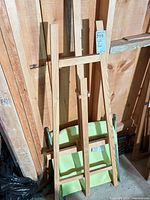 Full view of easel front with folded chair leaning behind