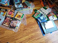 Group of cookbooks, gardening, travel and nonfiction books spread on floor