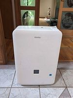 Front view of dehumidifier showing overall condition