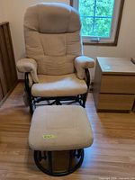 Full view of upholstered glider chair with ottoman