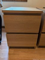 Front view of nightstand showing two drawers