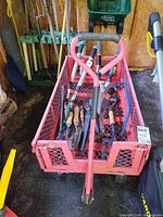 Top view of pink metal mesh garden wagon showing pull handle and interior bed