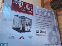 Front of retail box showing crate and dog image