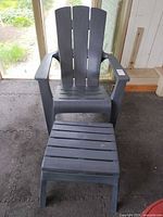 Front view of plastic resin Adirondack chair with matching ottoman