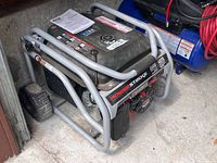 Full view of generator with manual on tank