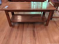 Front angled view showing full coffee table and lower shelf