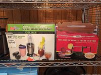 Total Chef Miracle Mixer Deluxe and Multifunctional Fruit Cutter boxes on shelf
