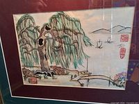 Full view of framed painting showing willow tree, bridge, boats and double mat