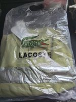 Shirt in sealed Lacoste retail bag