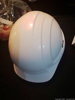 Top view of unwrapped white hard hat shell