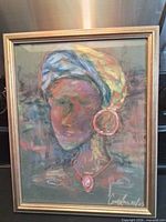 Full view of framed mixed media portrait