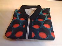 Shirt folded showing pattern, zipper, collar