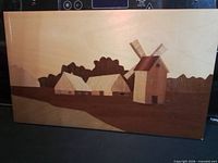 Front view of marquetry plaque showing full landscape design