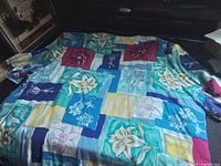 Full jacket laid flat showing overall patchwork floral design