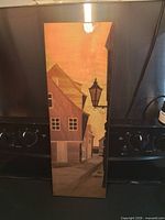 Full front view of rectangular wood marquetry panel showing Old Town Riga scene