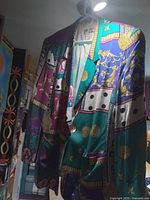 Front view of blazer hanging showing full patchwork design and pockets