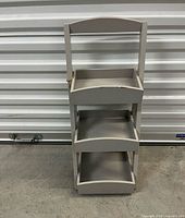 Full view of beige 3-tier ladder caddy