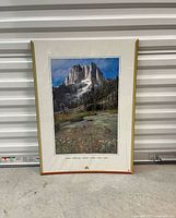Full view of framed Howser Spire poster against backdrop