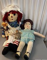 Group of four dolls laid on table