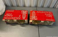 Two retail packages each holding four Arlington punch cups