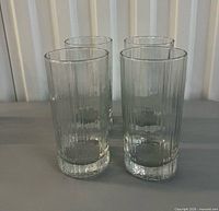 Four ribbed highball glasses front view