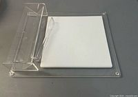 Top view of acrylic tray showing white insert and tongs