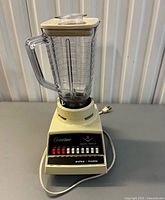 Front view showing base, control panel, jar, lid and cord