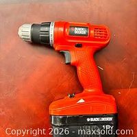 Front view of Black & Decker 18V cordless drill/driver with attached battery