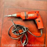 Full view of Hilti TKT 1300 drill with cord coiled