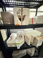 Shelved plaster molds with straps and labels