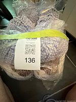 Sealed package showing 8 balls of Bernat Blanket yarn with lot tag